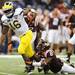 Michigan junior quarterback Denard Robinson looks to run the ball past Virginia Tech cornerback Detrick Bonner during the second half of the Sugar Bowl in New Orleans, LA on Tuesday.  Melanie Maxwell I AnnArbor.com 